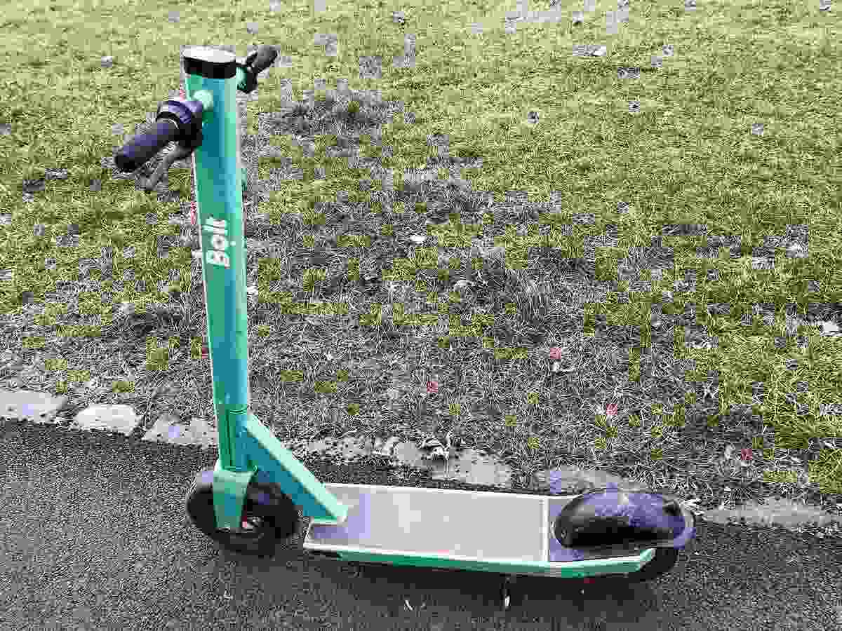 Riding an Electric Scooter in the Rain with Reduced Grip and Limited Water Resistance